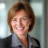 Lisa, 45, professional smiling in bright office